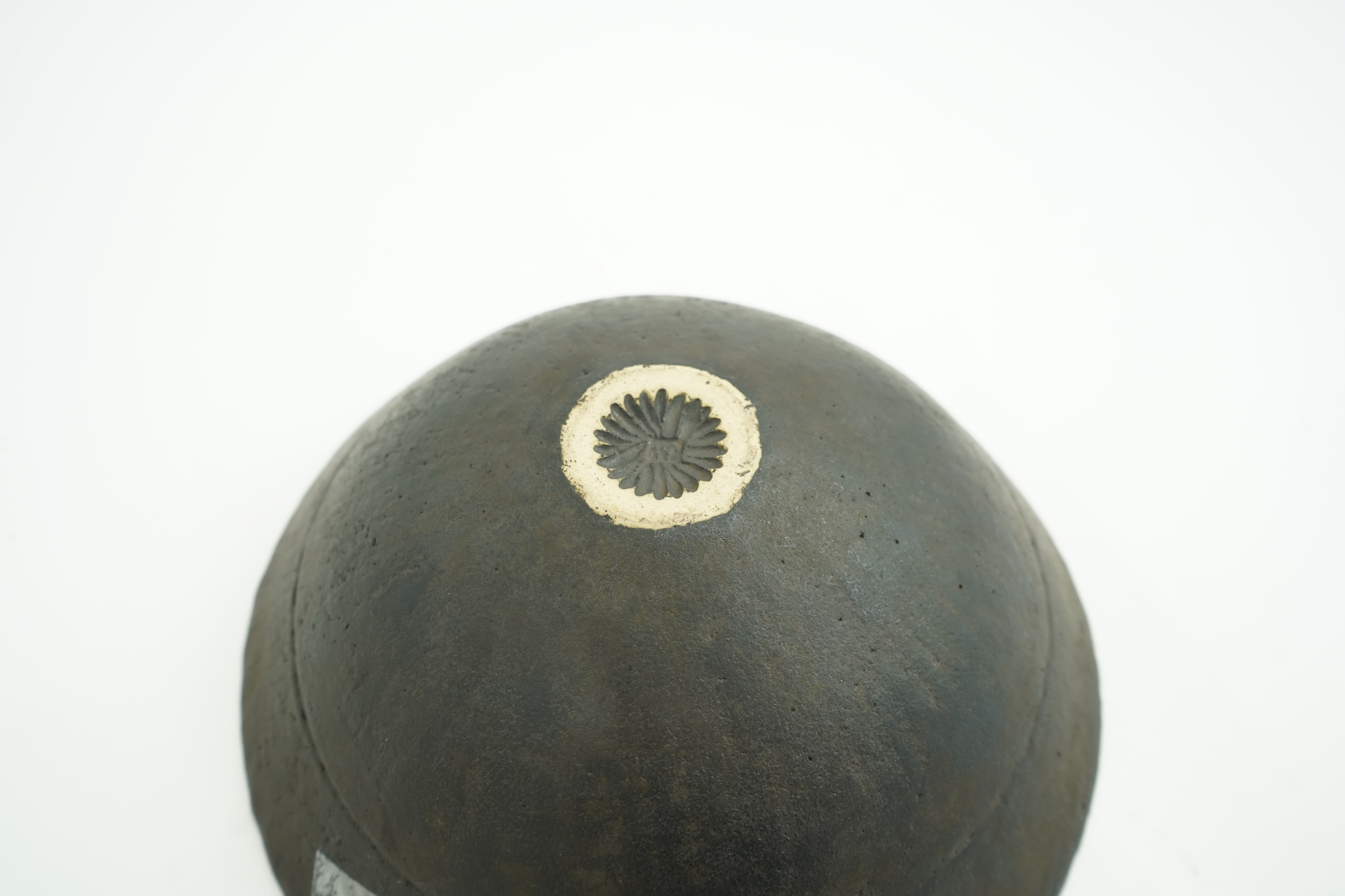 John Ward (1938-2023): A hand-built stoneware black glazed bowl with irregular rim